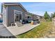 Spacious backyard with a well-kept lawn and charming patio, perfect for outdoor activities and entertaining guests at 15565 E 115Th Ave, Commerce City, CO 80022
