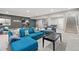 Finished basement area with comfortable seating, exercise equipment, and ample space for recreation at 15565 E 115Th Ave, Commerce City, CO 80022