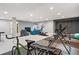Spacious basement with exercise equipment, a lounge area, and ample room for various activities at 15565 E 115Th Ave, Commerce City, CO 80022