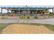 Beautiful clubhouse featuring a large covered patio with seating and well-maintained landscaping at 15565 E 115Th Ave, Commerce City, CO 80022