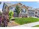 Charming home with manicured lawn and mature landscaping, creating appealing curb appeal at 15565 E 115Th Ave, Commerce City, CO 80022