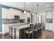 Beautiful kitchen with a large center island, stainless steel appliances, and modern finishes at 15565 E 115Th Ave, Commerce City, CO 80022