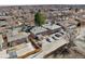 Aerial view showcasing a neighborhood with tree-lined streets and multiple residences at 1173 Dallas St, Aurora, CO 80010