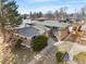 Brick apartment building featuring a basketball hoop, lush landscaping, and a private parking area at 1173 Dallas St, Aurora, CO 80010