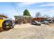 Wide angle view of a backyard featuring a large parking area and convenient access to the upper level at 1173 Dallas St, Aurora, CO 80010