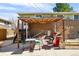 Inviting backyard with covered patio, outdoor dining area, and convenient grill setup at 1173 Dallas St, Aurora, CO 80010