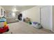 Finished basement with carpet, painted walls, and ample space for entertaining or relaxing at 1173 Dallas St, Aurora, CO 80010