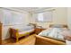 Inviting bedroom with hardwood floors and bright windows, ideal for relaxation at 1173 Dallas St, Aurora, CO 80010