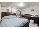 Spacious bedroom featuring a large bed, crib, dresser, and soothing neutral tones at 1173 Dallas St, Aurora, CO 80010