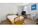 Bedroom with a twin bed and light blue curtains at 1173 Dallas St, Aurora, CO 80010