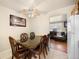 Cozy dining area adjacent to the living room with a view of the backyard at 1173 Dallas St, Aurora, CO 80010