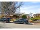 Lovely home exterior with well-kept lawn, mature tree, and street parking at 1173 Dallas St, Aurora, CO 80010