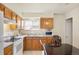 Functional kitchen area with light wood cabinets and essential appliances at 1173 Dallas St, Aurora, CO 80010