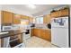 Kitchen with white appliances and lots of cabinet space at 1173 Dallas St, Aurora, CO 80010