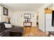 Inviting living room featuring hardwood floors, and a view into the kitchen area at 1173 Dallas St, Aurora, CO 80010