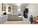 Inviting living room offers a comfortable sectional couch, neutral carpet and ample space at 1173 Dallas St, Aurora, CO 80010