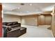Spacious finished basement featuring carpeted flooring, recessed lighting, and a cozy seating area for entertainment at 5929 Dunraven Way, Golden, CO 80403