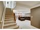 Finished basement with carpet, finished stairs and a comfortable seating area, perfect for relaxing or entertaining at 5929 Dunraven Way, Golden, CO 80403