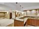 Basement bar area featuring a marble countertop, sink, and custom lighting at 5929 Dunraven Way, Golden, CO 80403