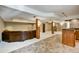 Finished basement with a bar area, comfortable seating, and custom lighting at 5929 Dunraven Way, Golden, CO 80403