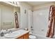Bathroom with a tub, shower, single sink vanity, and neutral color palette at 5929 Dunraven Way, Golden, CO 80403