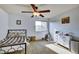 Bright bedroom featuring a ceiling fan and natural light at 5929 Dunraven Way, Golden, CO 80403