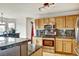 Modern kitchen with granite countertops, stainless steel appliances, and ample cabinet space at 5929 Dunraven Way, Golden, CO 80403