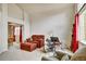 Spacious living room with high ceilings, plush furniture, a large window, and an adjacent dining area at 5929 Dunraven Way, Golden, CO 80403