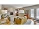 Inviting living room featuring a fireplace, plush seating and large windows providing plenty of natural light at 5929 Dunraven Way, Golden, CO 80403