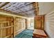 Shed interior with wood walls and partially open door at 5929 Dunraven Way, Golden, CO 80403
