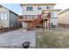 Large backyard features a deck, patio, and lush lawn, perfect for outdoor entertaining at 18809 W 92Nd Dr, Arvada, CO 80007