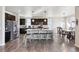 Spacious kitchen with a center island, stainless steel appliances, and a dining area at 18809 W 92Nd Dr, Arvada, CO 80007