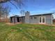 A backyard view of the home, deck, and gazebo at 6757 Lee St, Arvada, CO 80004