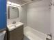 Updated bathroom with a modern vanity and combined bathtub and shower at 6757 Lee St, Arvada, CO 80004