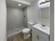 Renovated bathroom featuring a walk-in shower and modern vanity at 6757 Lee St, Arvada, CO 80004