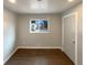 Cozy bedroom with neutral walls and a window offering natural light at 6757 Lee St, Arvada, CO 80004