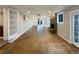 Spacious living area featuring hardwood floors, recessed lighting and a stone fireplace at 6757 Lee St, Arvada, CO 80004