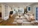 Modern living room with stone fireplace, recessed lighting, and neutral decor at 6757 Lee St, Arvada, CO 80004