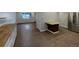 Open living room area with light-filled windows and a stylish breakfast bar at 6757 Lee St, Arvada, CO 80004