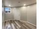An interior room with vinyl flooring and a window at 6757 Lee St, Arvada, CO 80004