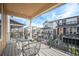 Comfortable covered balcony with neighborhood views, perfect for relaxing outdoors at 8948 Delacorte St, Highlands Ranch, CO 80129