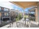 Relaxing covered balcony offering an outdoor seating area and neighborhood views at 8948 Delacorte St, Highlands Ranch, CO 80129