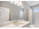 Clean bathroom with a single vanity, shower-tub combination, and neutral tones, creating a serene space at 8948 Delacorte St, Highlands Ranch, CO 80129