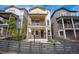 Attractive two-story home boasting a welcoming entrance, charming porch, and a fenced yard at 8948 Delacorte St, Highlands Ranch, CO 80129