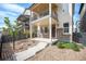 Inviting covered front porch of home featuring well-kept landscaping and stone accents at 8948 Delacorte St, Highlands Ranch, CO 80129