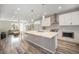 Modern kitchen featuring a spacious island, stainless steel appliances, and a bright, open layout at 8948 Delacorte St, Littleton, CO 80129
