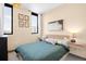 Spacious bedroom features contemporary decor, large windows, and comfortable furnishings at 603 Inca St # 432, Denver, CO 80204