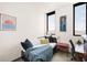 Bright room with daybed near windows showcasing the cityscape, creating an inviting space at 603 Inca St # 432, Denver, CO 80204
