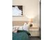 This bedroom features a cozy decor, a stylish bedside lamp, and floating nightstand at 603 Inca St # 432, Denver, CO 80204