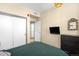 Well-lit bedroom featuring a TV, a dresser, and two closets at 603 Inca St # 432, Denver, CO 80204